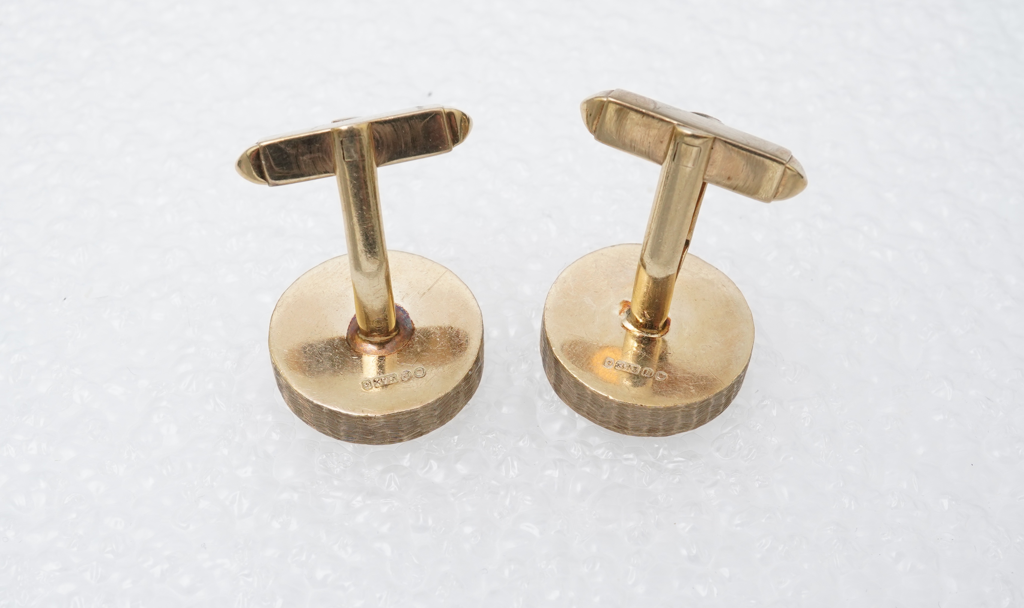 A pair of gold cufflinks, circa 1964